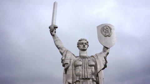 Aerial fly around view of Motherland giant steel monument sculpture in Kiev, Ukraine. Face, eyes, sword, shield.