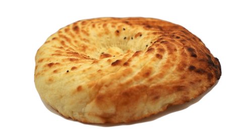 Tasty ready-made beautiful bread pita bread rotates on a white background. 4k