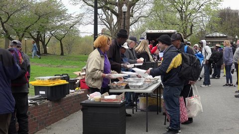 Boston, Massachusetts / USA - APRIL 28, 2019:
Free feeding & distribution of clothes for homeless in the Boston Common park. 