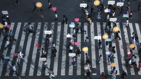 High Angle Shot of a Crowded Pedestrian Crossing in Big City. Augmented Reality of Social Media Signs, Symbols, Location Tracking and Emojis are Added to People. Future Technology Concept.