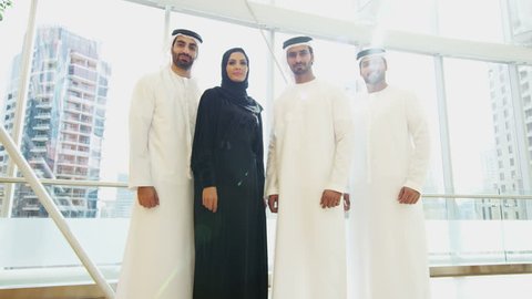 portrait Emirati male female business colleagues meeting office oil development