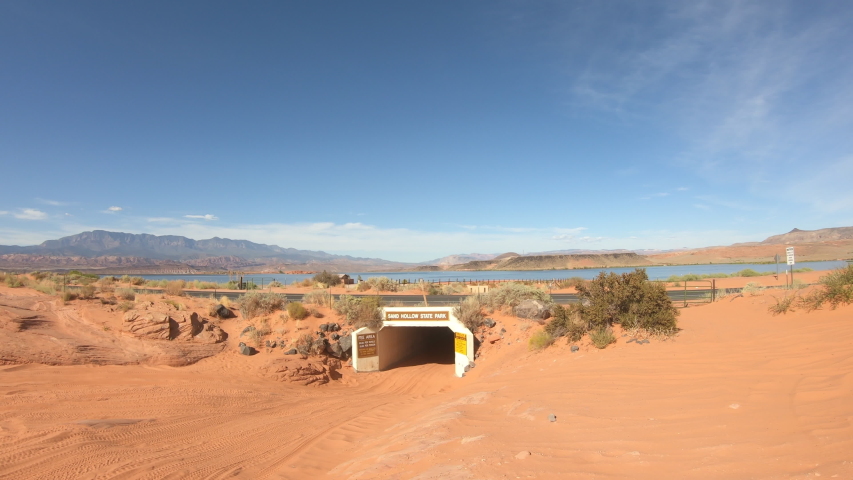 Off road 4x4 recreation Sand Hollow tunnel bright light. Southern Utah desert Sand Hollow. Red sandstone, dirt sand trails. Outdoor extreme 4x4 recreation ride and adventure.