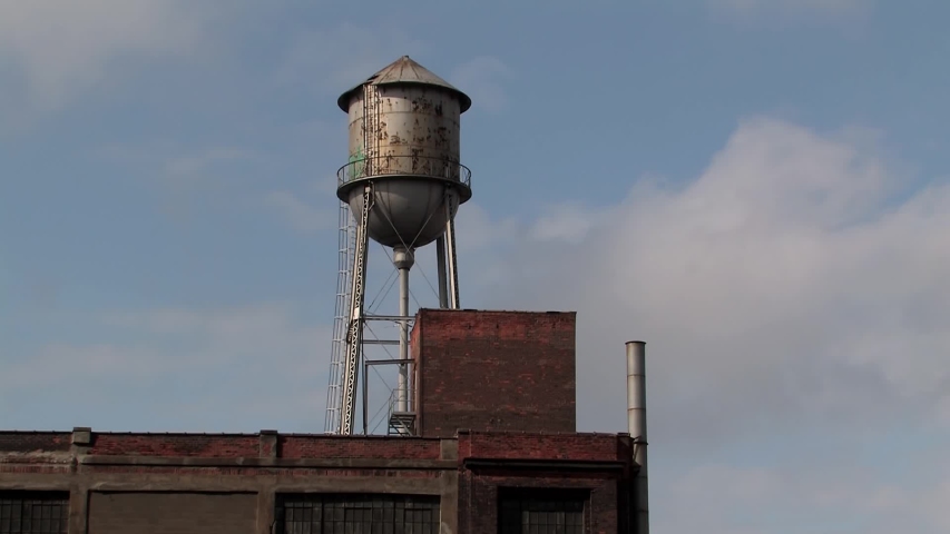 Water tower on the roof of an old warehouse in Detroit, Michigan, USA.