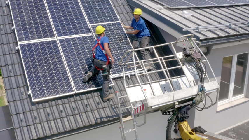 Installers Fitting Solar Panels On Roof. Slow Aerial Dolly Back | Shutterstock HD Video #1038836264