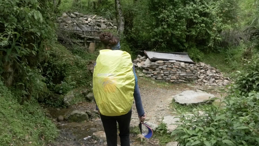 Young Woman Hiking on Path in the Nepal Himalaya, Annapurna Region, Slow Motion