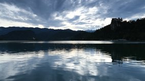 Time lapse of sunset with clouds on Lake Bled. Julian Alps, Slovenia.
