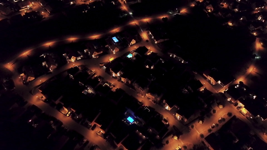 Aerial view of power outage blackout in suburban neighborhood.

Relevant to coronavirus, covid-19, sars-cov-2 corona virus viral outbreak. | Shutterstock HD Video #1038851882