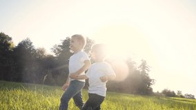Happy family walking: funny slow motion video little kid boy hold hands go nature play whirl a and girl brother and sister hold lifestyle hand on nature happy children concept. children happy family