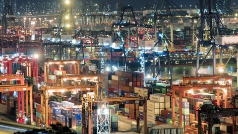 HONG KONG, CHINA - CIRCA AUGUST, 2019: Shipping containers on dock container terminal Container shipyard at Night timelapse