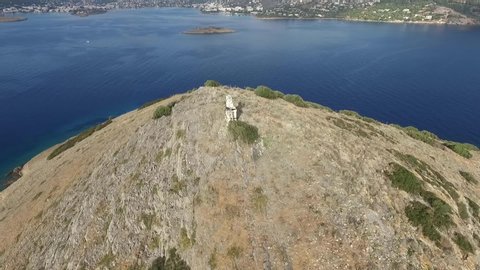 Island Rafti with statue - Porto Rafti Greece