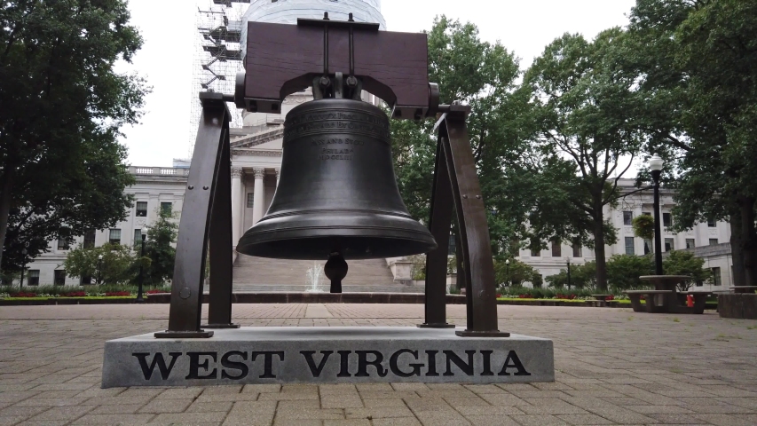 Pull back from memorial bell at West Virginia State Capitol complex.