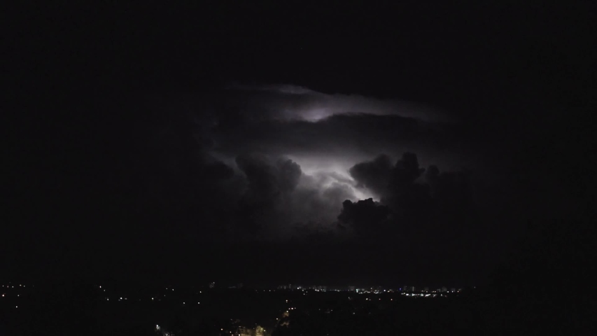 A thunderstorm raging in the distance off the coast of Mooloolaba, Sunshine Coast Australia.  Royalty-Free Stock Footage #1038882449