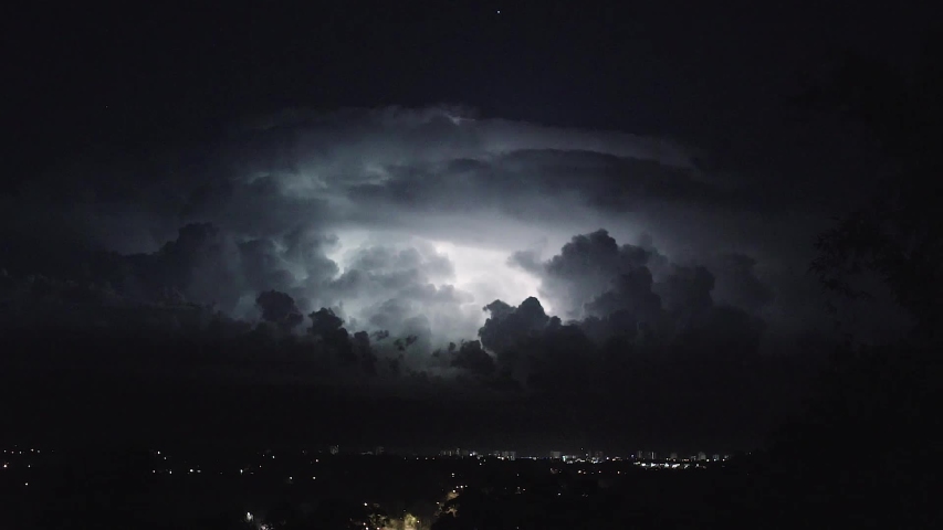 A thunderstorm raging in the distance off the coast of Mooloolaba, Sunshine Coast Australia.  Royalty-Free Stock Footage #1038882452