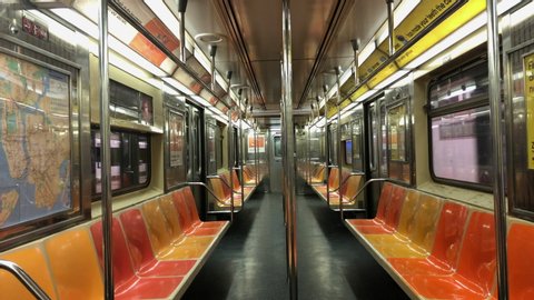 New York , New York / United States - 02 08 2019: No passengers aboard an in service New York City subway train