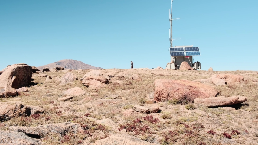 Hiker reaching summit of Almagre mountain in Colorado, US