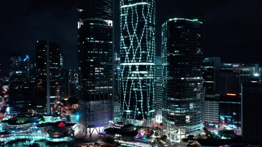 Brisbane city, Australia aerial night view. Eagle Street pier, EY bulding, skyscrapers, city lights, night view, traffic and traffic lights, Brisbane river aerial drone video 4k quality clip. 