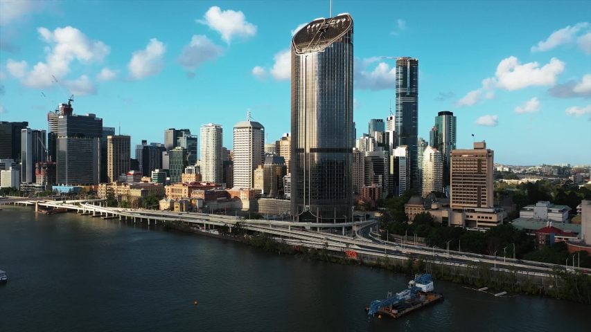 Brisbane, Australia. Skyscrapers, Brisbane river, Streets beach, highway with fast moving cards during sunset time.