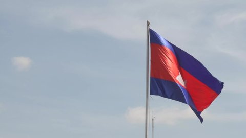 Zoomed in Cambodian Flag against blue sky,ing in the breeze
