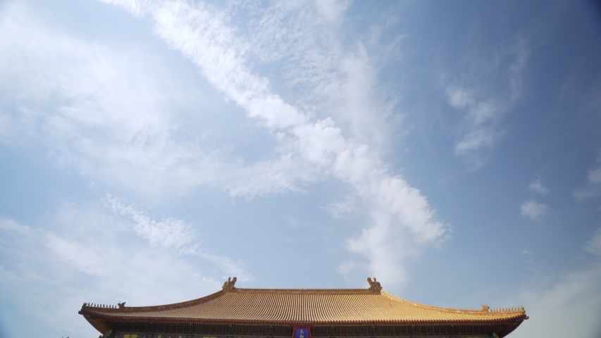 Tilt Down: Tourists on footpath in forbidden city against sky - Beijing, China