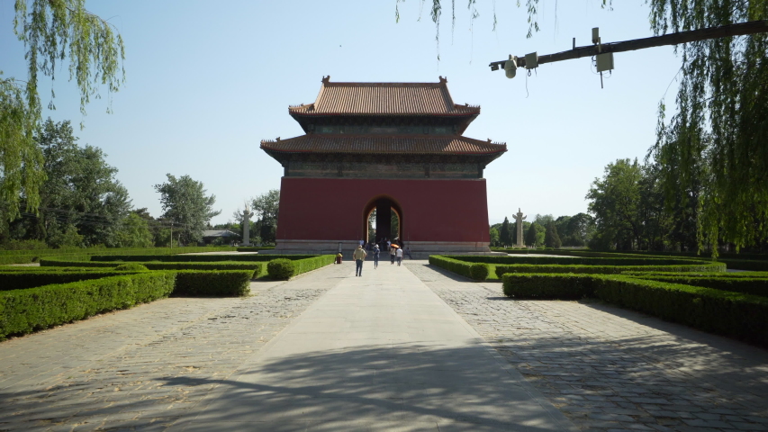 Tourists walking on the sacred way at Shengong Shengde Stele Pavilion against sky - Beijing, China
