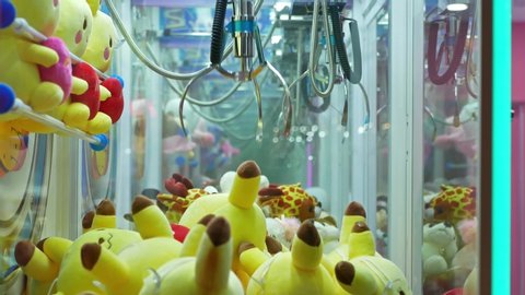 Kuala Lumpur,Malaysia - October 13,2019 : Colorful arcade game toy claw crane machine where people can win toys and other prizes which is located in the shopping mall,Kuala Lumpur. 