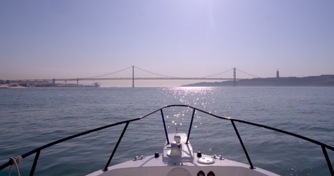 Bow cockpit boat ride. Lisbon bridge and Christ the king on the frame.
Shot at Lisbon, Portugal.
