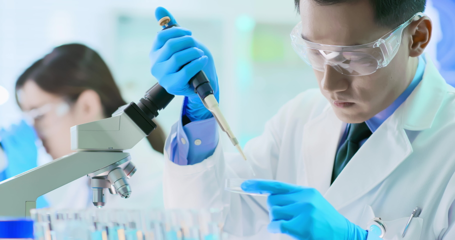 Asian scientist team take petri dish in the laboratory | Shutterstock HD Video #1038943364