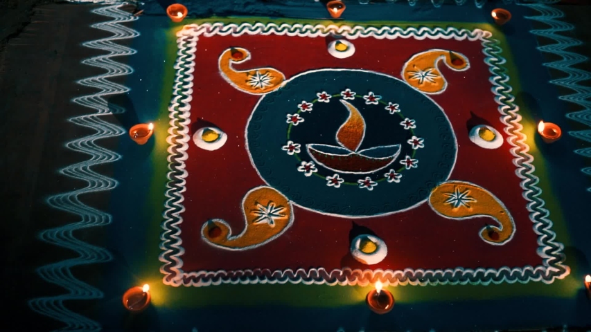 Bright and colorful Indian traditional rangoli decoration , Deepak with colourful rangoli