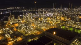 Hyperlapse Timelapse Aerial view night light oil refinery terminal is industrial facility for storage of oil and petrochemical. oil manufacturing products. power electric plant. footage video 4k.