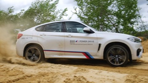 Moscow, Russia - May, 2019: Offroad extreme safari driving on BMW X6M F86. Skidding in the sand
