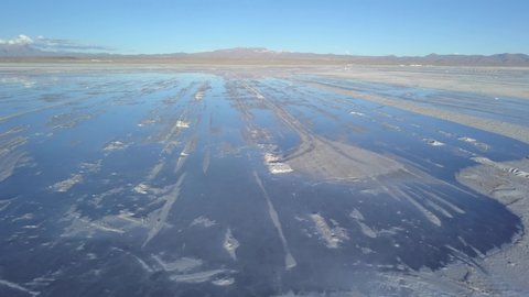 Aerial of Uyuni salt flat, the largest global reservoir of lithium. DOLLY OUT