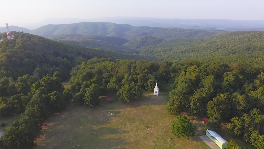 Aerial drone footage of beautiful park surrounded with forest