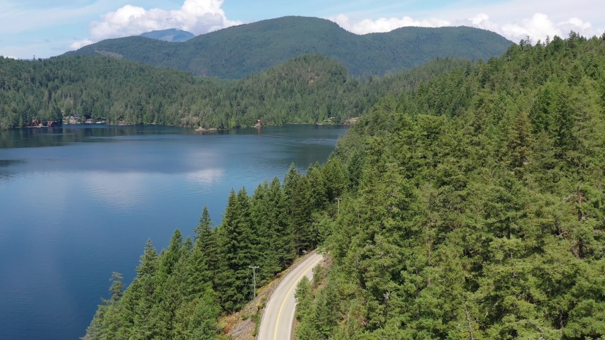 Aerial View at Mountain Lake with Blue Sky in British Columbia, Canada. 4K.