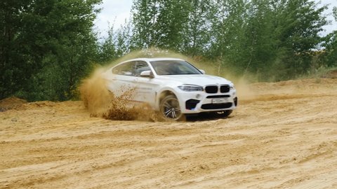 Moscow, Russia - May, 2019: Offroad extreme safari driving on BMW X6M F86. Drifting in the sand