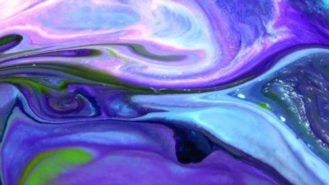 Liquid Colorful Paint pattens mix in slow motion. Liquid color paint patterns texture top view. Multicolor liquid paint surface.