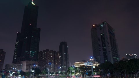 KAOHSIUNG, TAIWAN - 2019 circa: Kaohsiung main public library modern building and 85 sky tower at night. 4K hyperlapse
