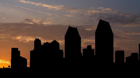 San Diego: Dark Skyline of City with Skyscrapers in Silhouette, Time Lapse at Sunrise, California, USA