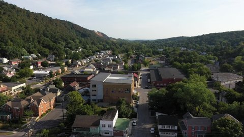 Aerial descent with view of the Ice House Arts Center in Berkeley Springs, West Virginia on a summer morning.