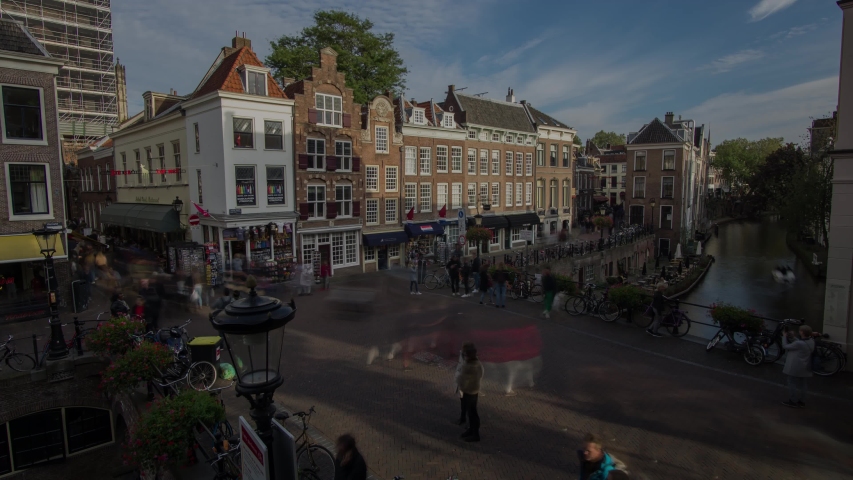 4k Time lapse of Utrecht city center with historic canal houses, canal and shopping people moving by