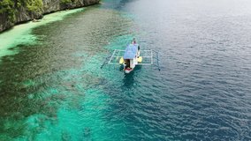 Aerial Drone footage of Island hopping tour, Matinloc Island, El Nido, Palawan, Philippines
