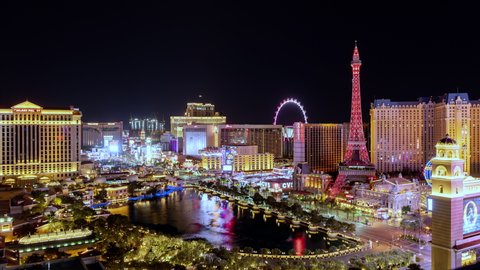 Las Vegas , Nevada / United States - 02 14 2019: Las Vegas strip timelapse transitioning from night to sunrise daytime with the Bellagio fountain