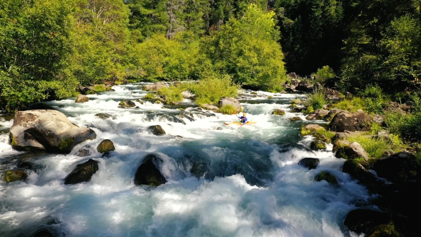 Aerial view of man whitewater kayaking the Mill Creek section of water on the upper Rogue River in Southern Oregon