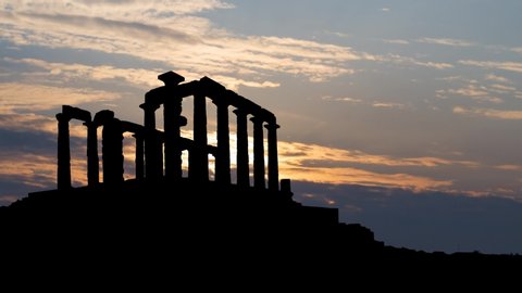 Ancient Greek Temple of Poseidon at Cape Sounion near Athens, Time Lapse at Sunrise with Coloful Sky and Dark Silhouette, Greece, Europe