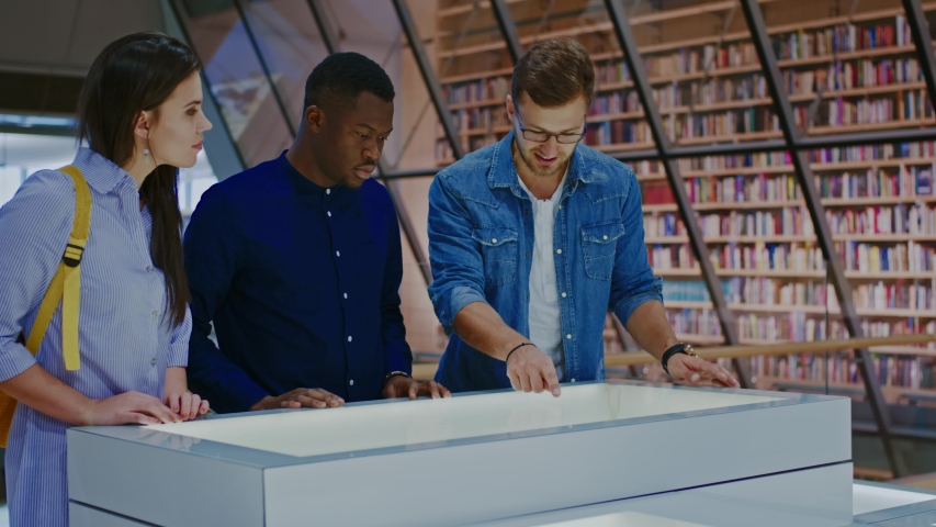 Multicultural group of students in a public library