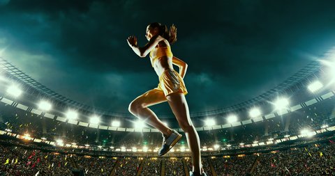 Track and field runner hurdles on the professional sports arena with bleaches full of people. Athlete wears unbranded clothes. Arena and people on it are made in 3D.