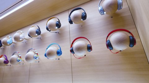Paris, France - Mar 19 2019: Multiple Audio headphones Beats by Dr Dre Apple products on mannequin heads are displayed inside the new Apple Store Champs-Elysees