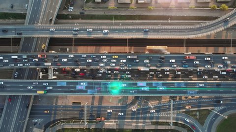 Beautiful top view to autonomous cars self-driving on multi-level highway in Moscow. Picturesque aerial panorama of the road traffic in a big city on the evening.