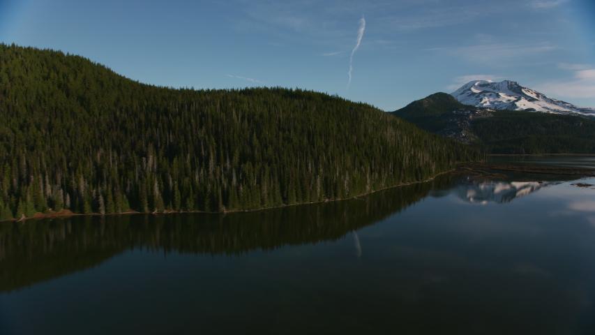 Cascade Mountains, Oregon circa-2019. Aerial view of Sisters Mountains. Shot from helicopter with Cineflex gimbal and RED 8K camera.