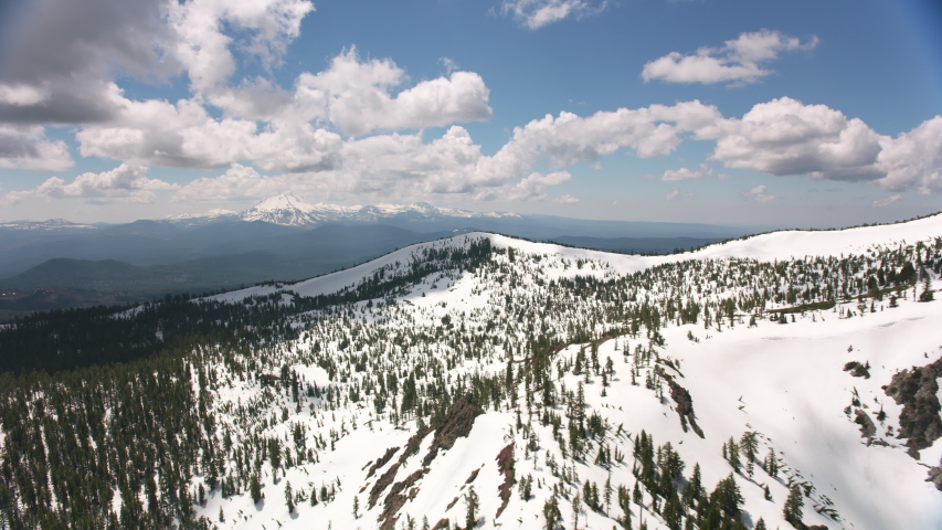 Cascade Mountains, California circa-2019. Aerial view of Lassen Peak. Shot from helicopter with Cineflex gimbal and RED 8K camera.
