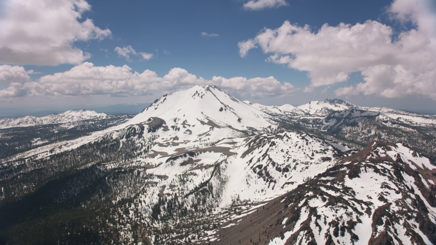 Cascade Mountains, California circa-2019. Aerial view of Lassen Peak. Shot from helicopter with Cineflex gimbal and RED 8K camera.